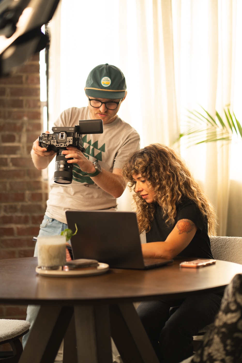 Shooter and editor reviewing takes on location