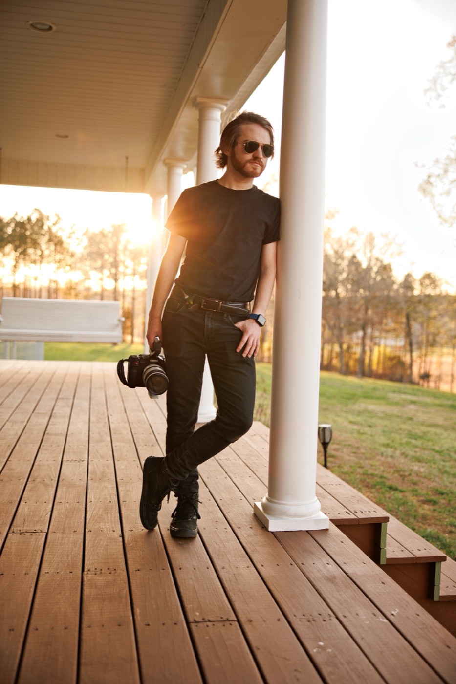 Brady Jordan with a camera at golden hour